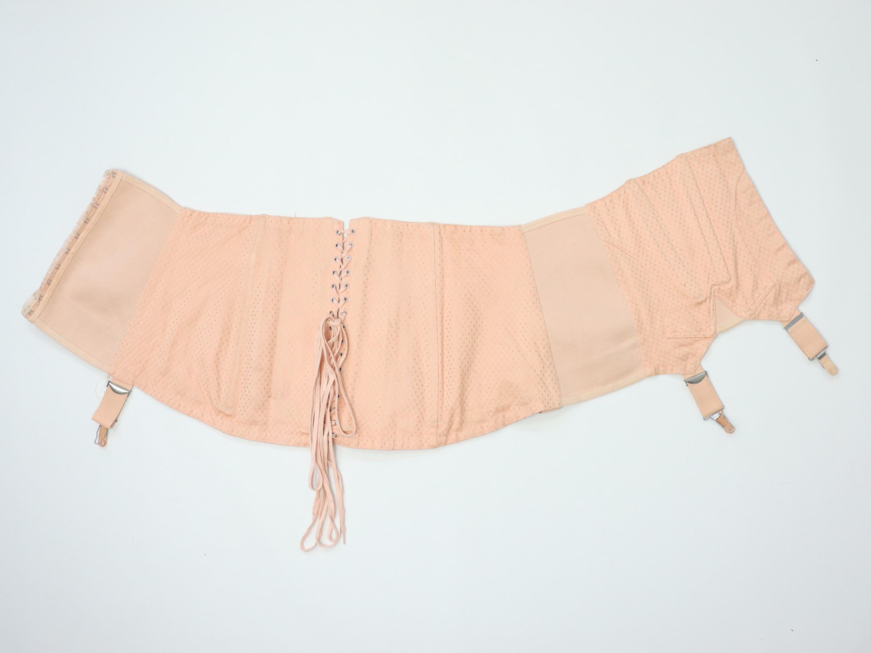 C1950s vintage pale pink corset girdle with back lacing