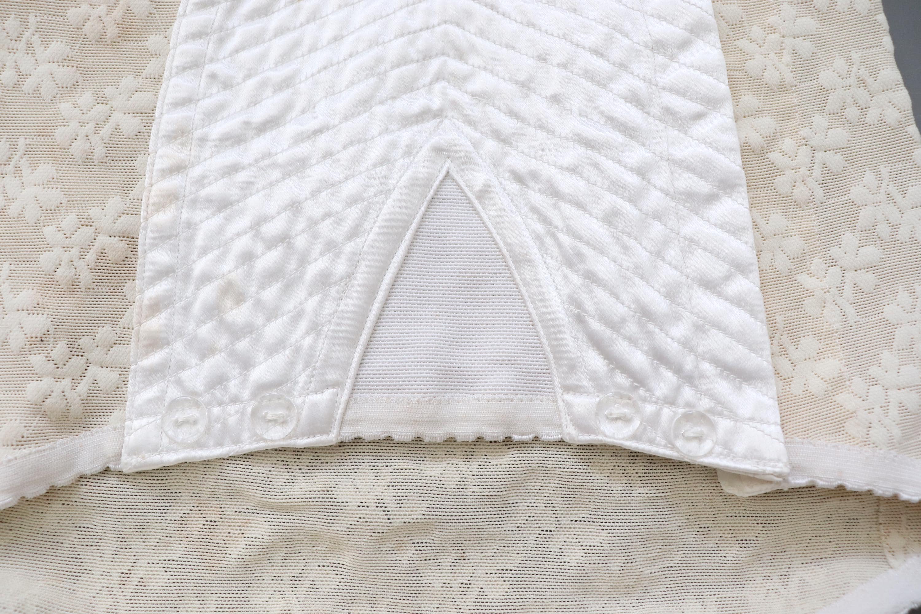 C1950s vintage cream embossed powernet and satin roll on corset girdle. 20-23" Waist