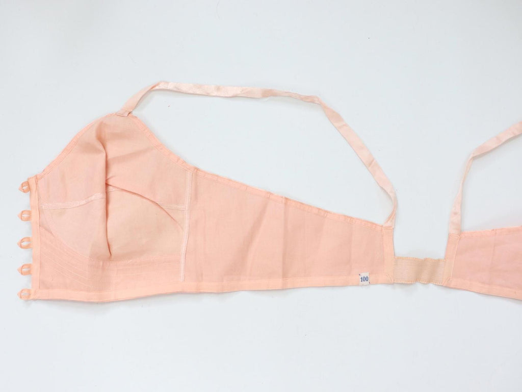 C1940s vintage pink button front longline bra