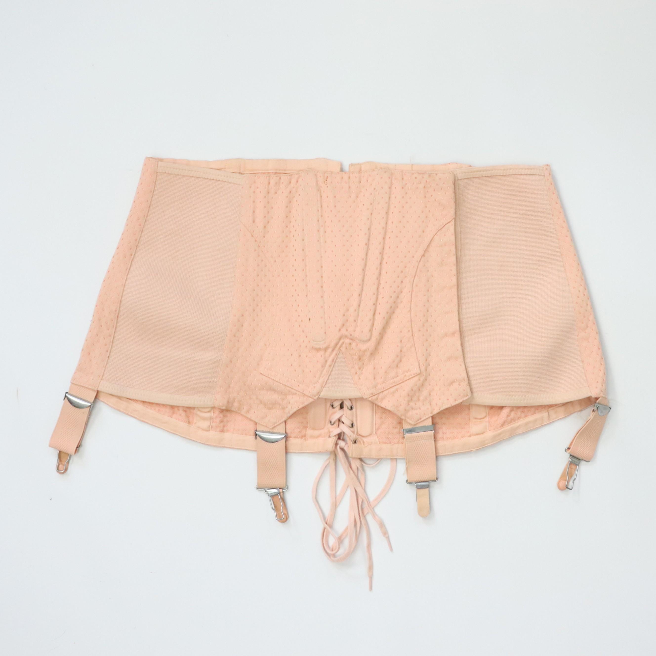 C1950s vintage pale pink corset girdle with back lacing