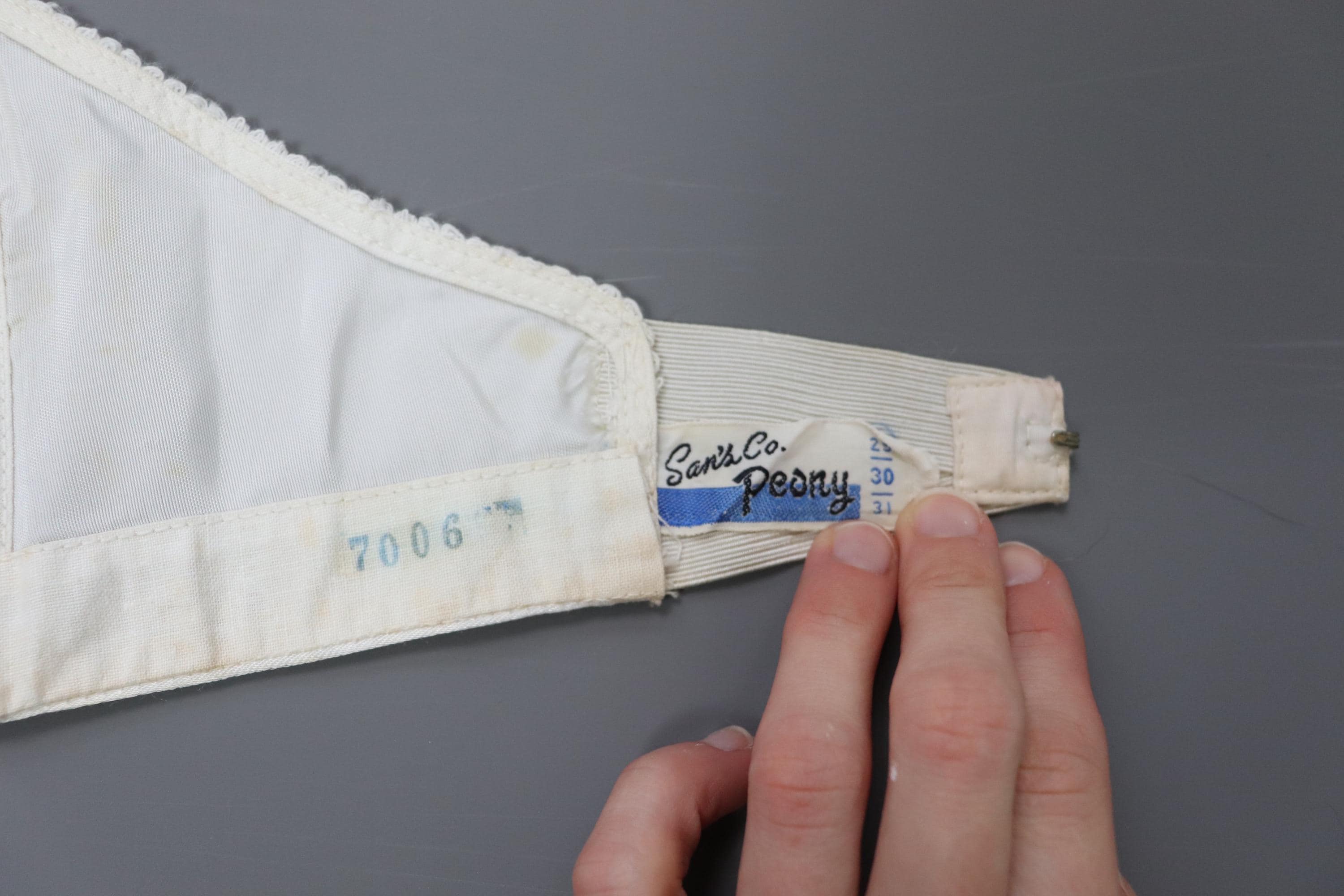 C1950s vintage 'San's Co Peony' boned cathedral bra, white strapless satin and lace bra