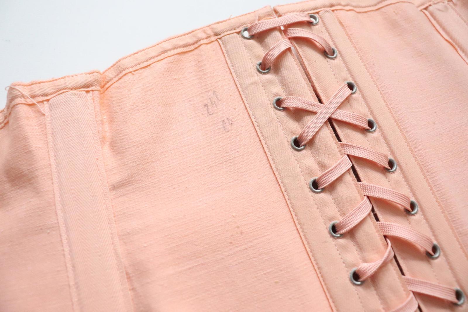 C1940s C1950s vintage pink coutil corset girdle with back lacing - 22 inch waist
