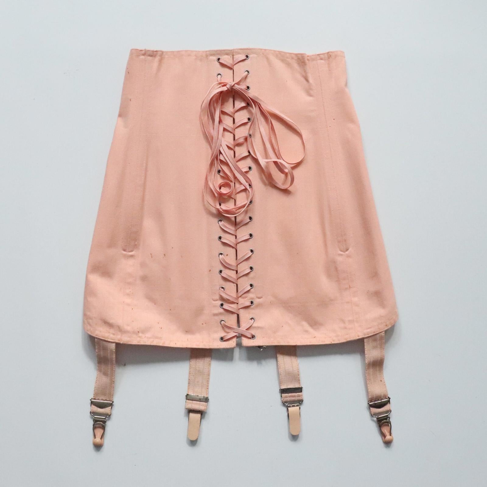 C1940s C1950s vintage pink coutil corset girdle with back lacing - 22 inch waist