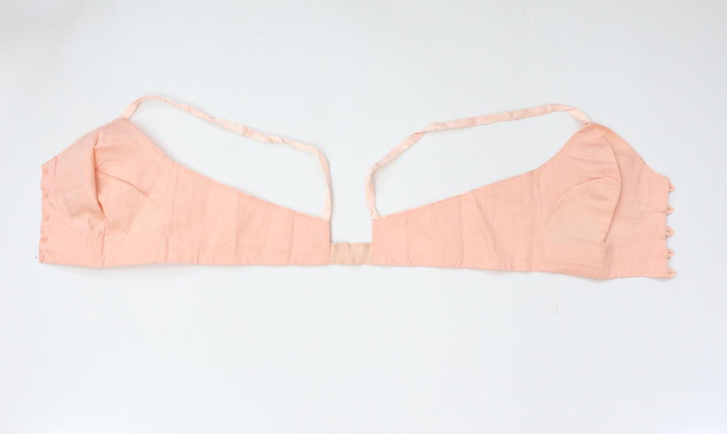 C1940s vintage pink button front longline bra