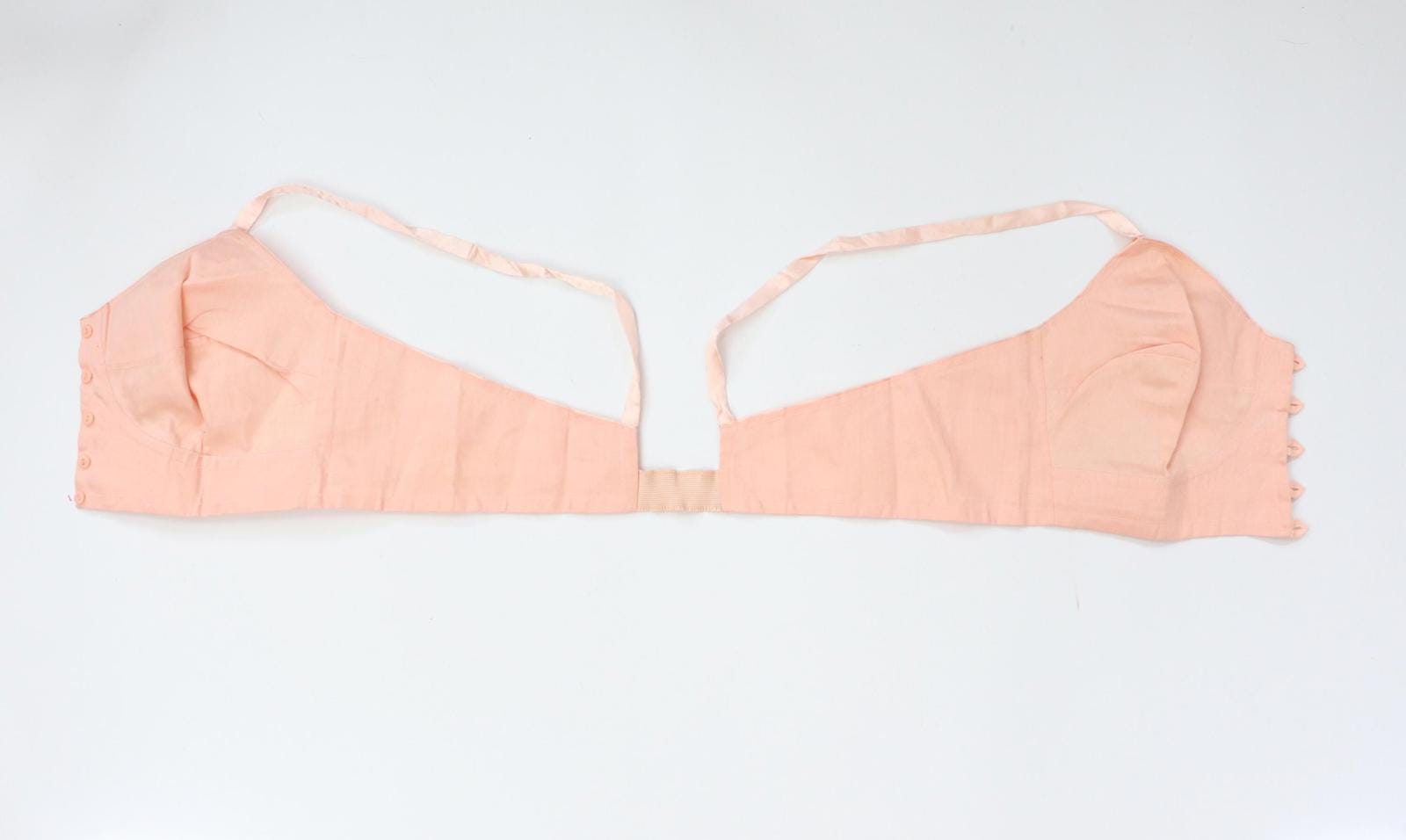 C1940s vintage pink button front longline bra