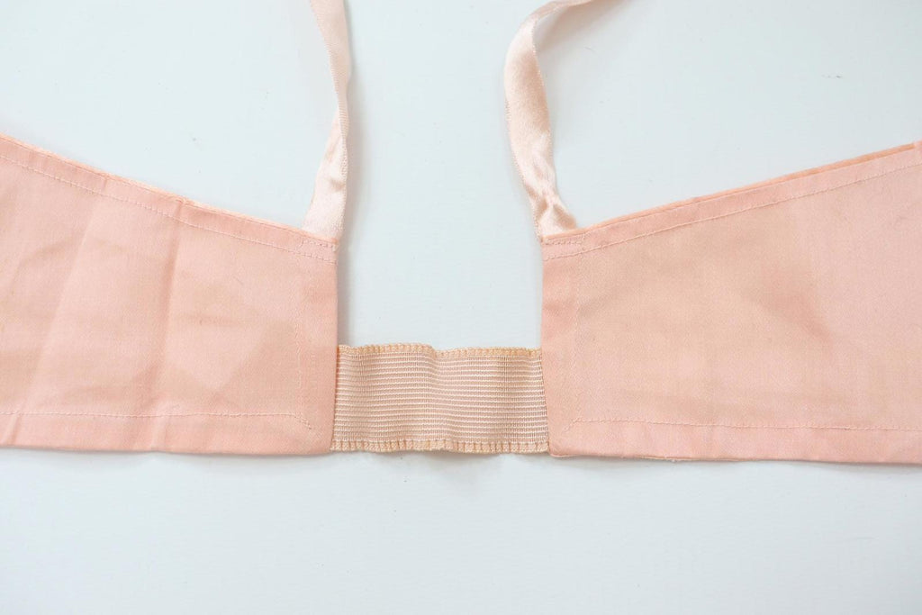 C1940s vintage pink button front longline bra