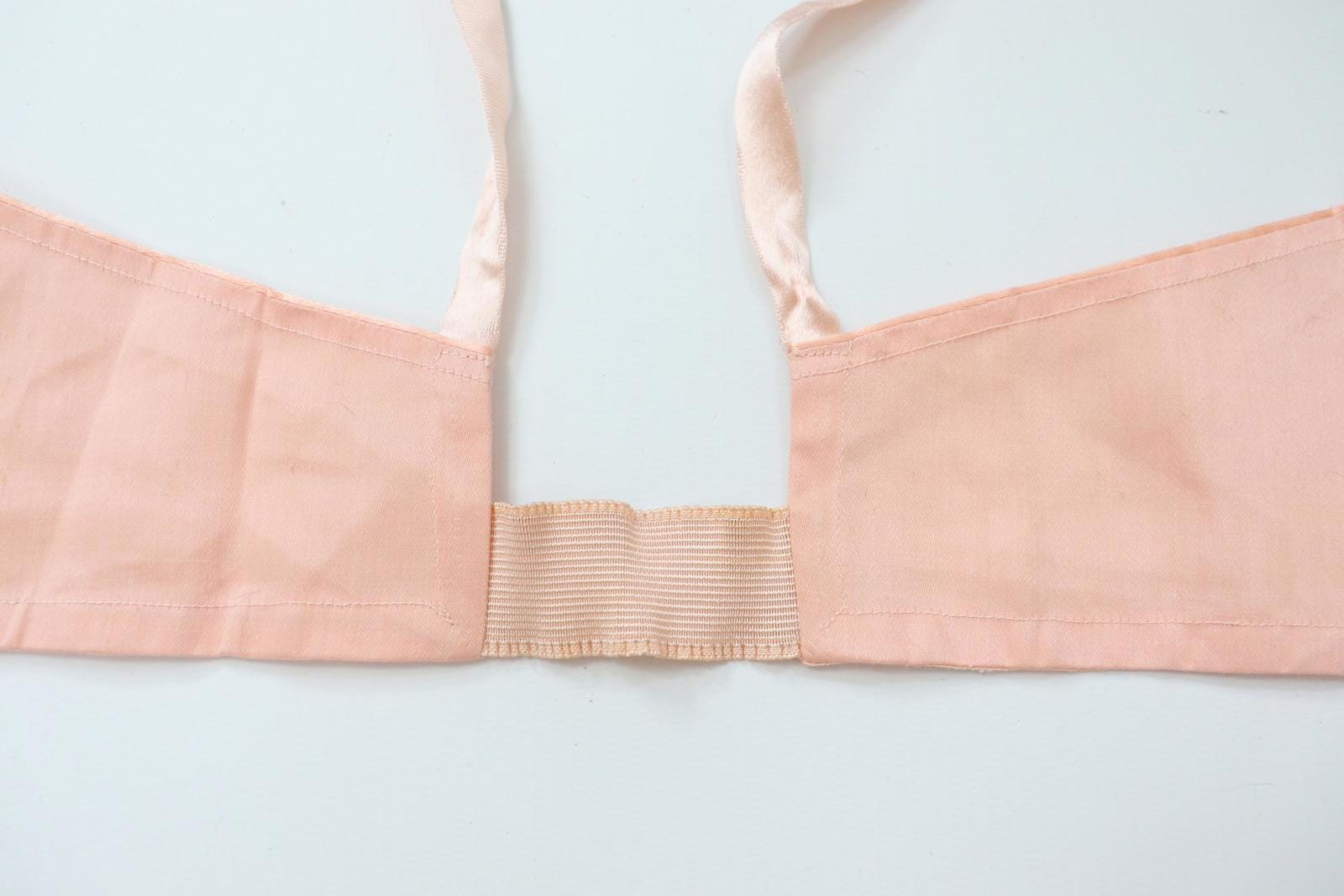 C1940s vintage pink button front longline bra