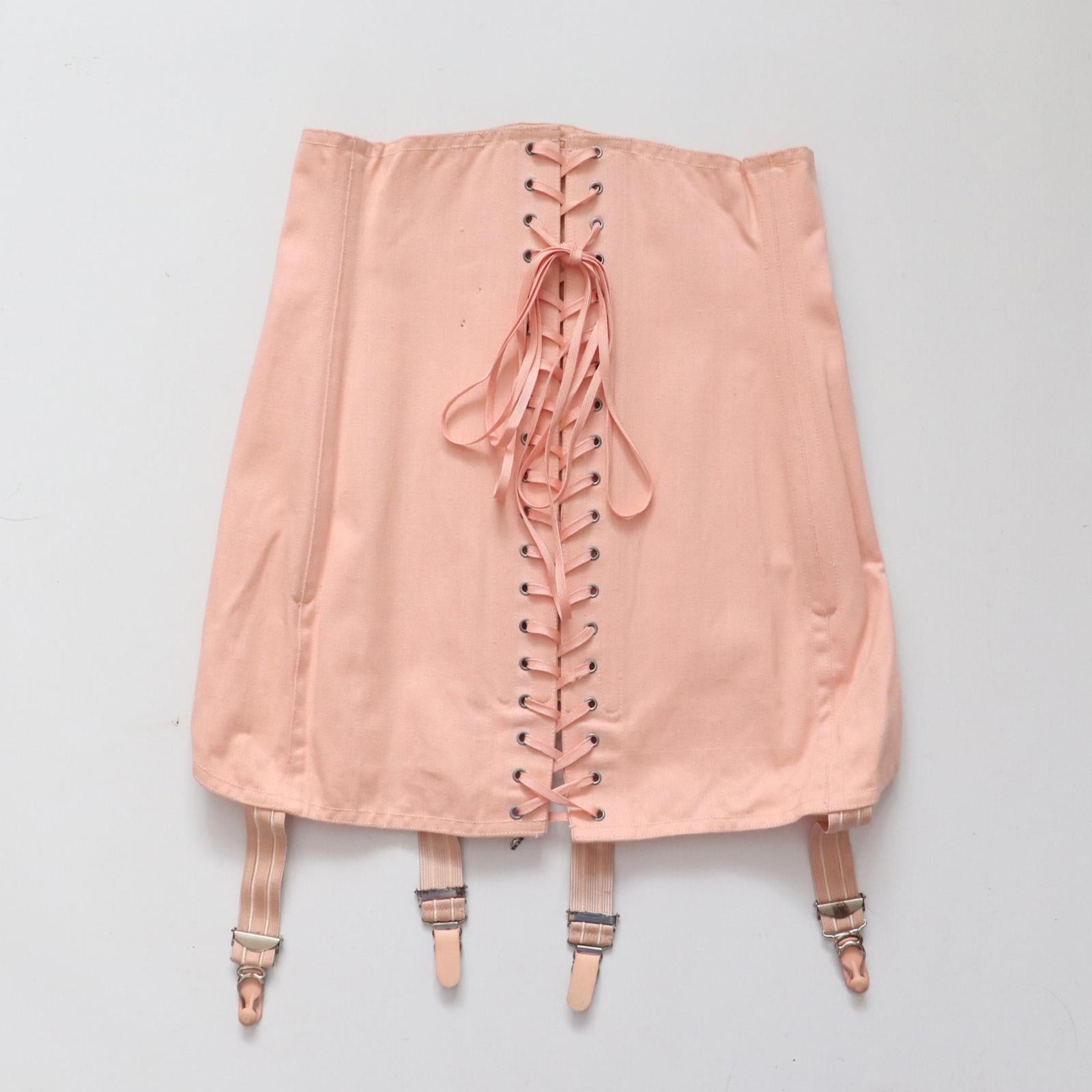 C1940s C1950s vintage pink coutil corset girdle with back lacing - 23 inch waist