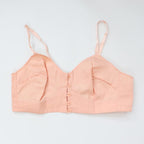 C1940s vintage pink button front longline bra
