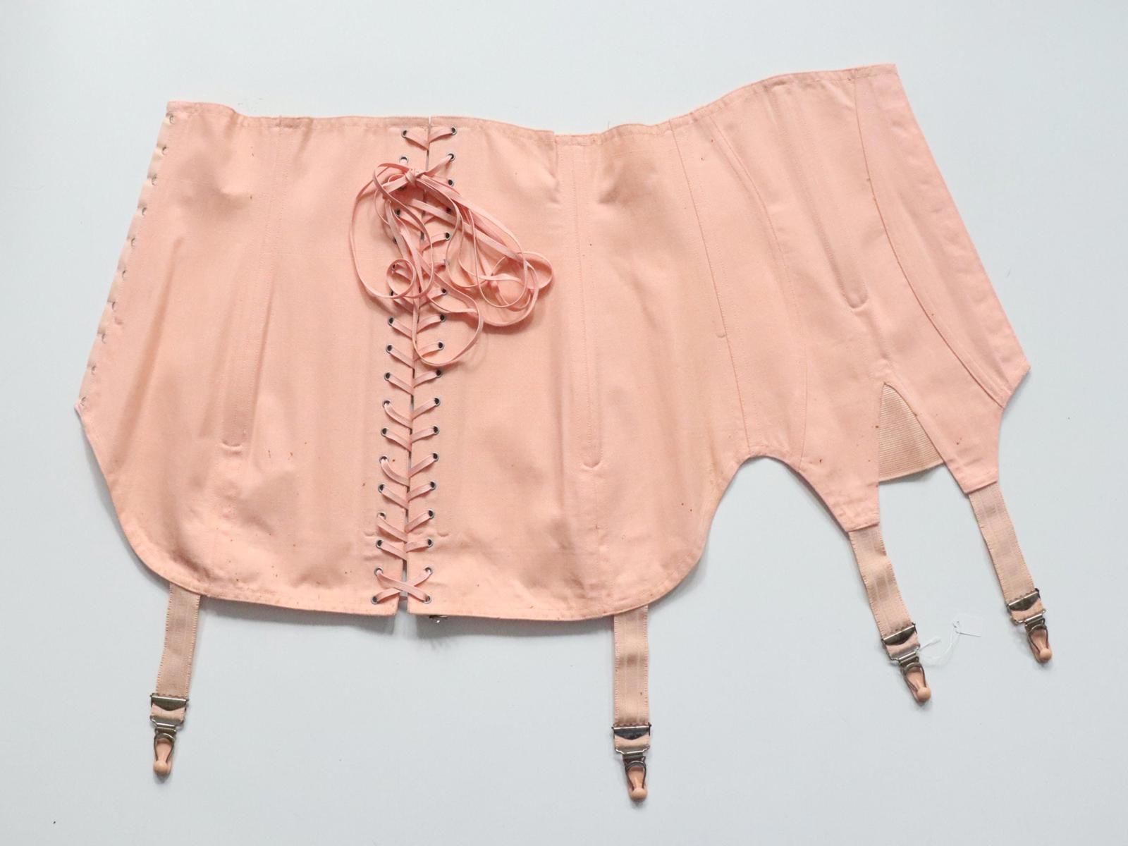 C1940s C1950s vintage pink coutil corset girdle with back lacing - 22 inch waist
