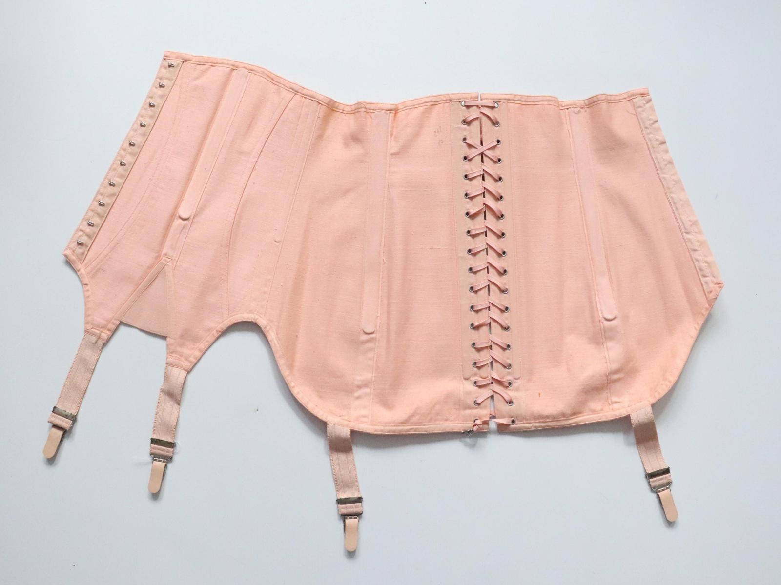 C1940s C1950s vintage pink coutil corset girdle with back lacing - 22 inch waist