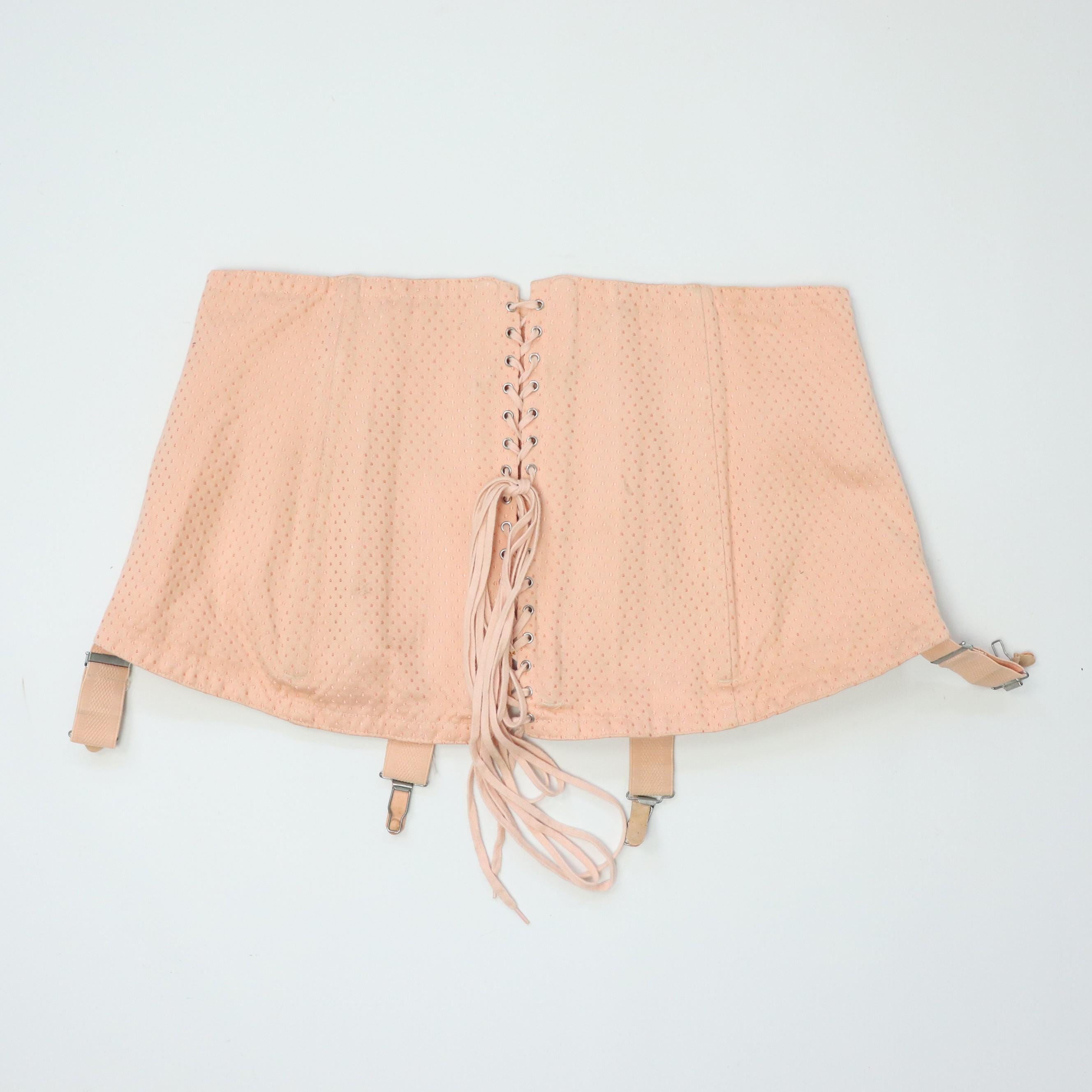 C1950s vintage pale pink corset girdle with back lacing
