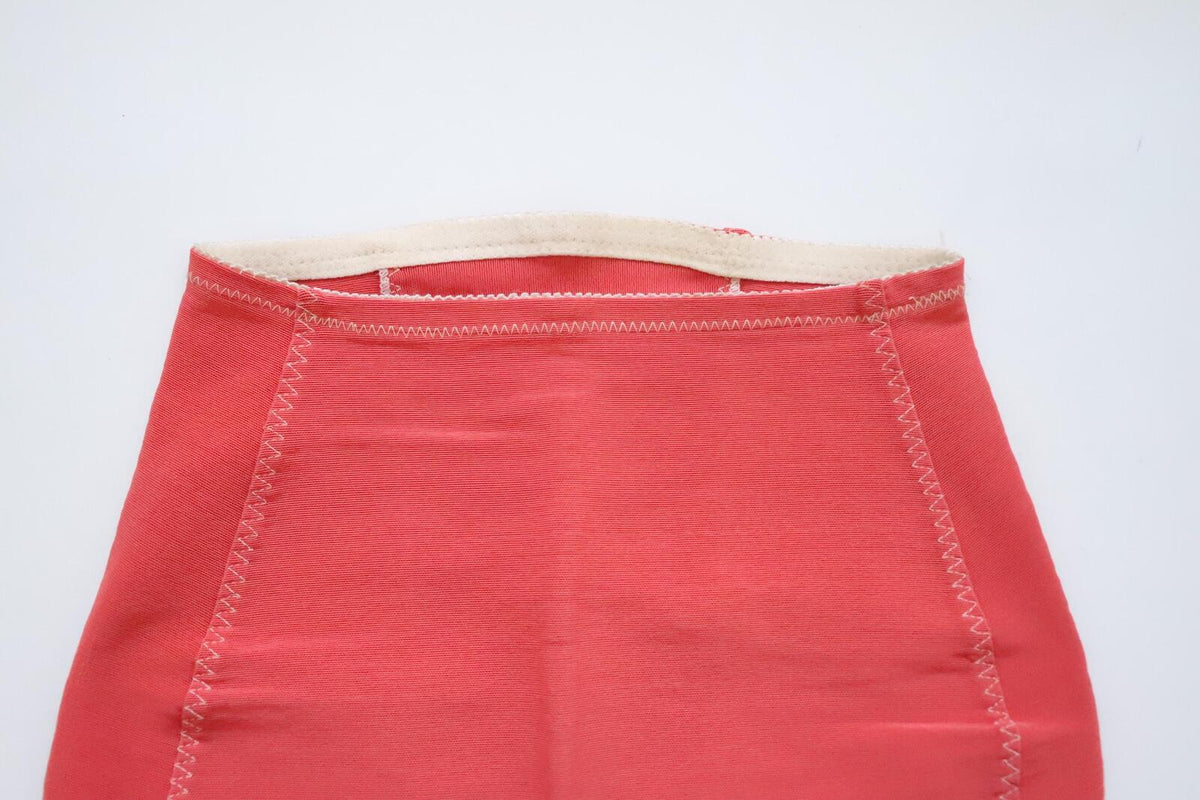 C1960s Vintage coral pink roll on corset girdle - waist 23-27 inch,