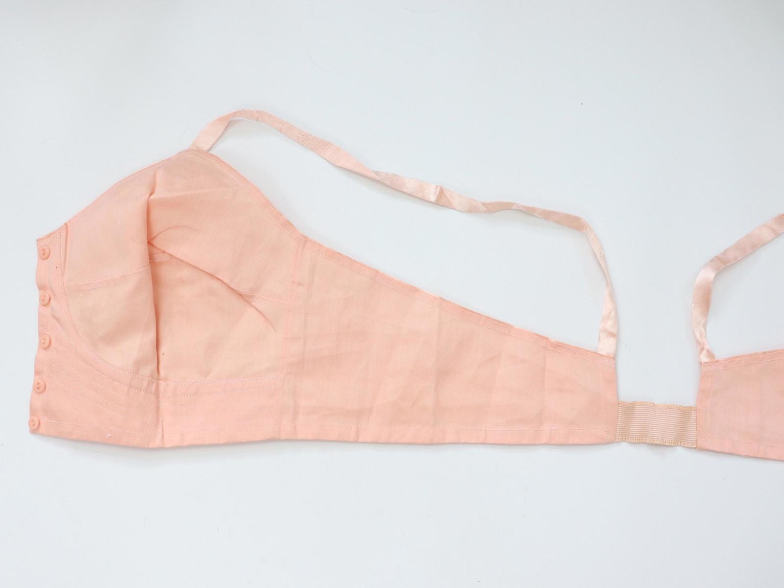 C1940s vintage pink button front longline bra