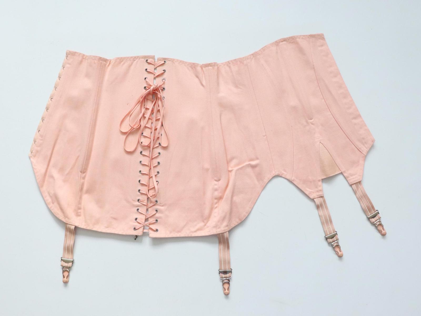 C1940s C1950s vintage pink coutil corset girdle with back lacing - 23 inch waist
