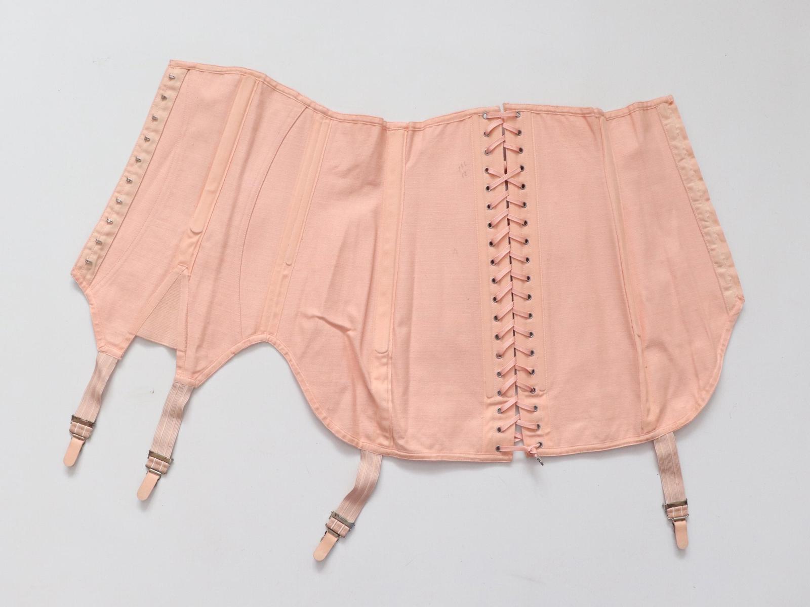 C1940s C1950s vintage pink coutil corset girdle with back lacing - 23 inch waist