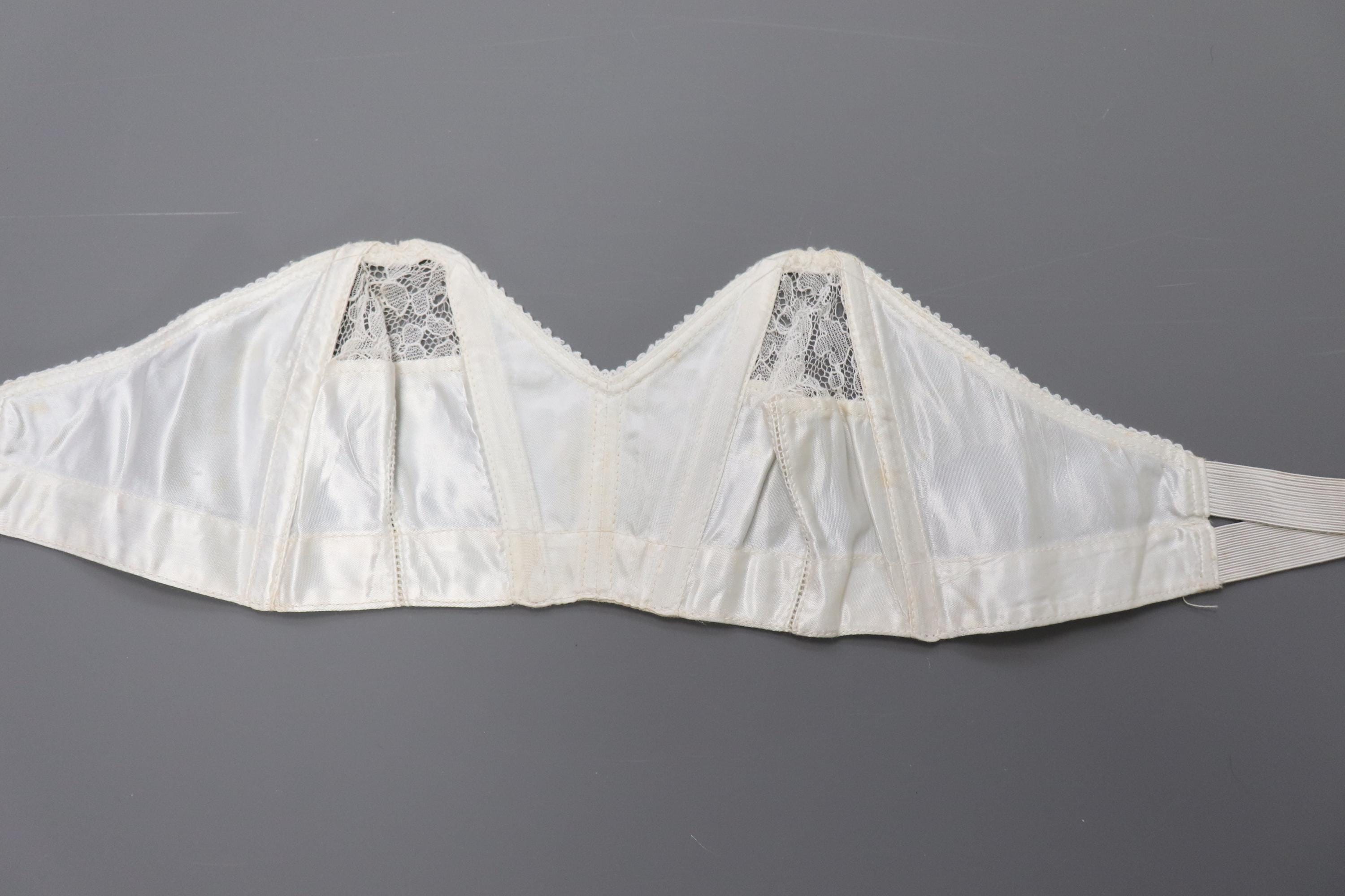 C1950s vintage 'San's Co Peony' boned cathedral bra, white strapless satin and lace bra