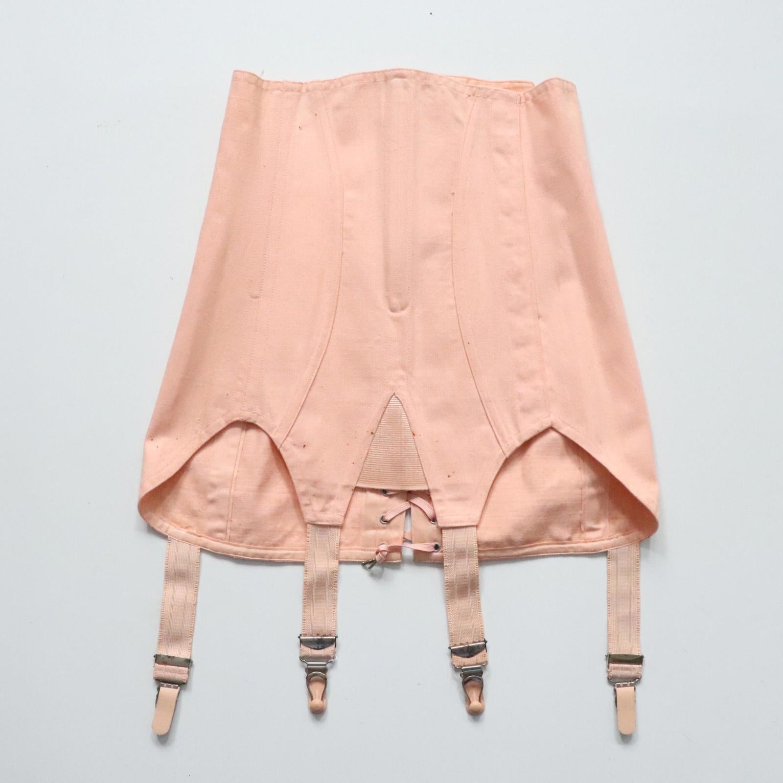 C1940s C1950s vintage pink coutil corset girdle with back lacing - 22 inch waist
